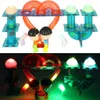 A split image showing a toy marble run with figures in the top half and the same toy illuminated with lights in the bottom half. Náhled obrázku produktu