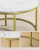 Close-up views of a round coffee table with a white marble top and gold metal legs and frame. Náhled obrázku produktu