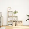 A bookshelf with decorative items and books against a white wall. Náhľad obrázku produktu