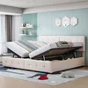 A bedroom scene with a bed that has storage space underneath. The bed is made up with bedding and pillows. Produktbild-Vorschau