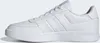 A side view of a white Adidas sneaker against a white background. Voir les images du produit