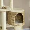 A close-up view of a cat tree with a woven basket-like hideaway. Podgląd zdjęcia produktu