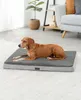 A dog is lying on a dog bed in a living room. Produktbild-Vorschau
