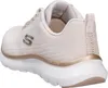 A side view of a beige Skechers sneaker. Voir les images du produit