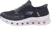 A side view of a black Skechers Glide-Step Pro sneaker with a white sole. Voir les images du produit