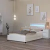 A white LED bed with a mattress and bedding, set in a bedroom with artwork on the wall. Produktbild-Vorschau