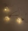 A string of LED lights shaped like small light bulbs, laid out diagonally on a plain background. Produktbild-Vorschau