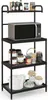 A black metal kitchen rack with a microwave and various jars and containers on its shelves. Anteprima dell’immagine prodotto