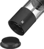 A close-up, angled shot of the bottom part of an electric salt and pepper grinder, with its black cap detached and placed below it. Produktbild-Vorschau