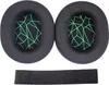 Two black ear pads with a green geometric pattern and a black headband pad are laid out on a white background. Náhled obrázku produktu