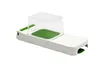 A white and green vegetable slicer with a clear plastic cover, isolated on a white background. Náhled obrázku produktu