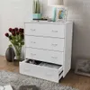 A white chest of drawers with four drawers, one of which is open, is shown in a room with a brick wall and a rug. Produktbild-Vorschau