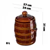 A brown ceramic barrel-shaped pot with a lid, shown against a white background with measurement indicators. Voir les images du produit