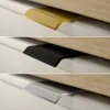 A collage of three close-up shots of cabinet or drawer pulls in different finishes. Produktbild-Vorschau
