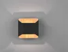 A modern square wall light with a black center and wood-like trim, mounted on a gray wall. Podgląd zdjęcia produktu