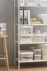 A white shelving unit filled with transparent storage boxes. Produktbild-Vorschau