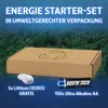 A cardboard box with a green leaf logo sits in front of a forest background. Two types of batteries are displayed in front of the box. Produktbild-Vorschau