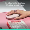 A hand with a ring is using a pink Logitech mouse on a pink mousepad, with a pink keyboard in the foreground. Náhľad obrázku produktu