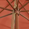 A close-up view of the central mechanism and pole of an open umbrella, showing the fabric and structural supports. Produktbild-Vorschau