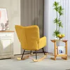 A yellow rocking chair is shown in a room with a cabinet and a plant. Náhled obrázku produktu