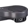 A close-up view of a gray electronic device, showing a speaker grille and a connection port. Produktbild-Vorschau