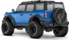 A blue Traxxas TRX-4M Ford Bronco 2021 1:18 RTR remote-controlled car is shown from a rear-side angle against a white background. Podgląd zdjęcia produktu