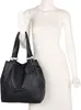 A black handbag displayed on a white mannequin. Voir les images du produit