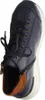 A close-up, top-down view of a blue sneaker with brown accents and a white sole, set against a white background. Produktbild-Vorschau