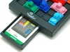 A close-up, angled shot of a Ravensburger ThinkFun Rush Hour game board with colorful car pieces and a challenge card inserted. Podgląd zdjęcia produktu