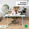 A woman is sitting at a white standing desk in a home office setting, with measurements and feature callouts overlaid on the image. Produktbild-Vorschau