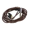 A coiled audio cable with two connectors on one end and a 3.5mm jack on the other, presented on a white background. Náhled obrázku produktu