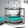 A corner shelf unit holding kitchenware inside a cabinet. Anteprima dell’immagine prodotto