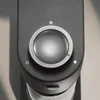 A close-up view of a control knob on a dark gray appliance. Produktbild-Vorschau