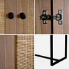 A collage of four close-up images showing details of a cabinet, including handles, a hinge, rattan weaving, and a metal leg. Produktbild-Vorschau