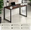 A desk with a laptop, mug, and lamp on it, with marketing text below. Náhled obrázku produktu