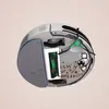 A cross-section view of the underside of a robot vacuum cleaner, showing its internal components and debris. Voir les images du produit