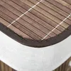 A close-up view of the corner of a laundry basket, showing the bamboo slats and fabric trim. Produktbild-Vorschau