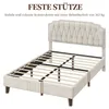 A bed frame with a tufted headboard and wooden slats is shown from a diagonal angle. Podgląd zdjęcia produktu