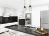 A modern kitchen with white cabinets, a black countertop, and stainless steel appliances. Náhled obrázku produktu