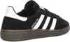 A close-up, side view of a black Adidas Handball Spezial sneaker. Voir les images du produit