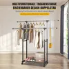 A double-tiered clothes rack with clothes and accessories on it, set in a room with a window and curtains. Anteprima dell’immagine prodotto