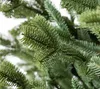 A close-up view of the branches and needles of an artificial Christmas tree. Produktbild-Vorschau