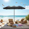 A beach scene with lounge chairs, an umbrella, and beach accessories. Produktbild-Vorschau