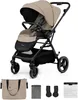 A beige and black Kinderkraft YOXI stroller is shown against a white background, with accessories displayed below. Náhled obrázku produktu