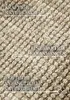 Close-up of a woven jute rug with text overlays highlighting its features. Podgląd zdjęcia produktu