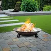 A fire pit with burning logs on a patio with artificial grass and landscaping. Anteprima dell’immagine prodotto