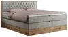 A king-size boxspring bed with a tufted headboard and a wooden frame. Produktbild-Vorschau