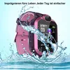 A pink and purple smartwatch is shown with water splashing around it, suggesting it is waterproof. Produktbild-Vorschau