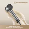 A sleek, modern hairdryer is presented against a flowing, creamy background, suggesting elegance and luxury. Náhled obrázku produktu