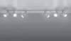 A track light fixture with six adjustable spotlights mounted on a ceiling. Produktbild-Vorschau